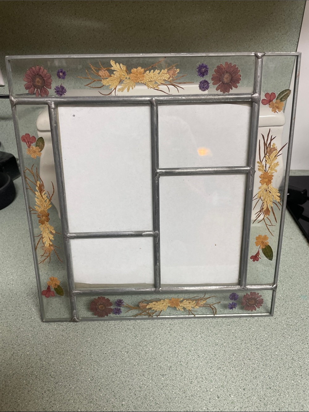 vintage leaded glass multi-photo frame featuring embedded pressed flowers